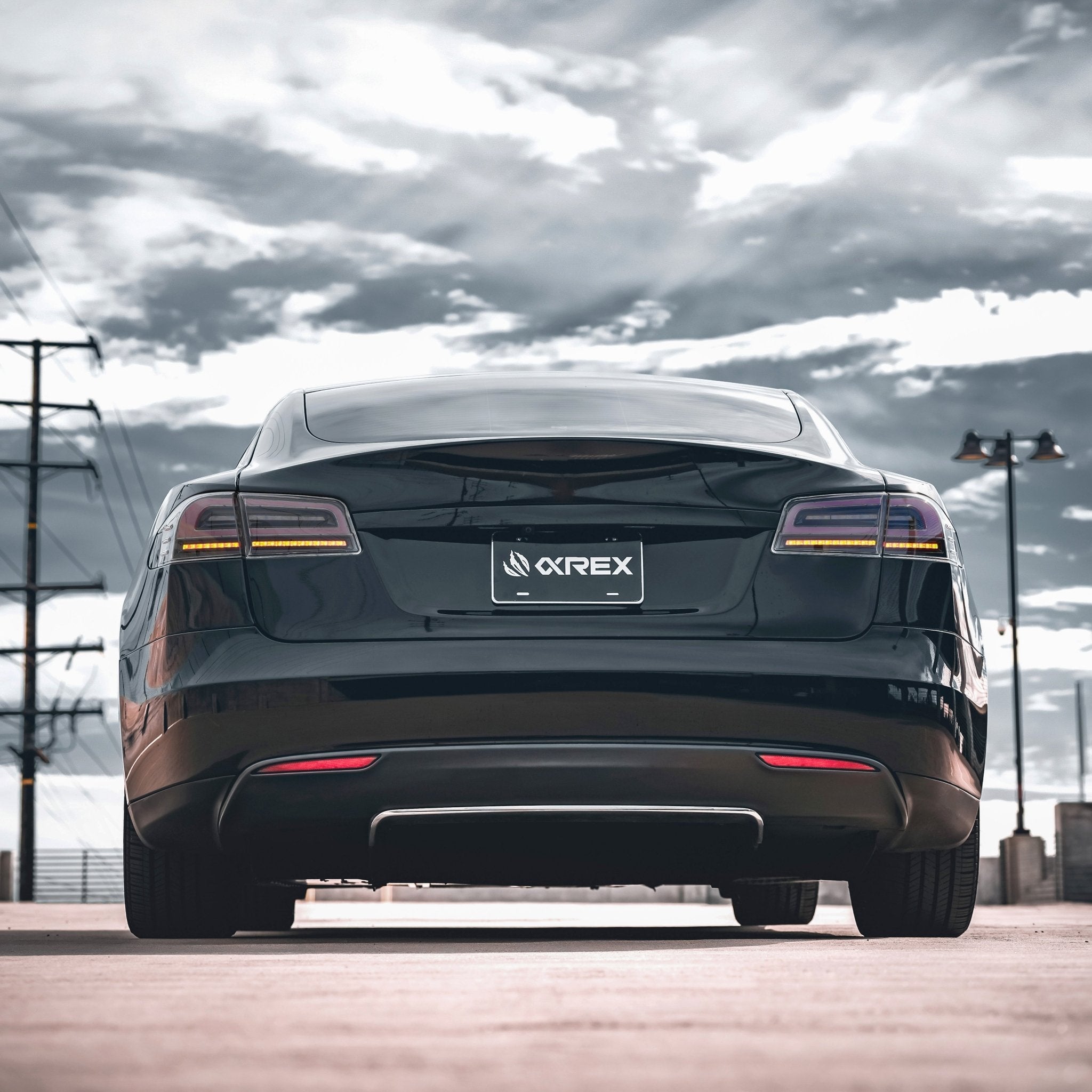 12-21 Tesla Model S LUXX-Series LED Tail Lights Black Smoke (With Black Trunk Center Piece Replacement)