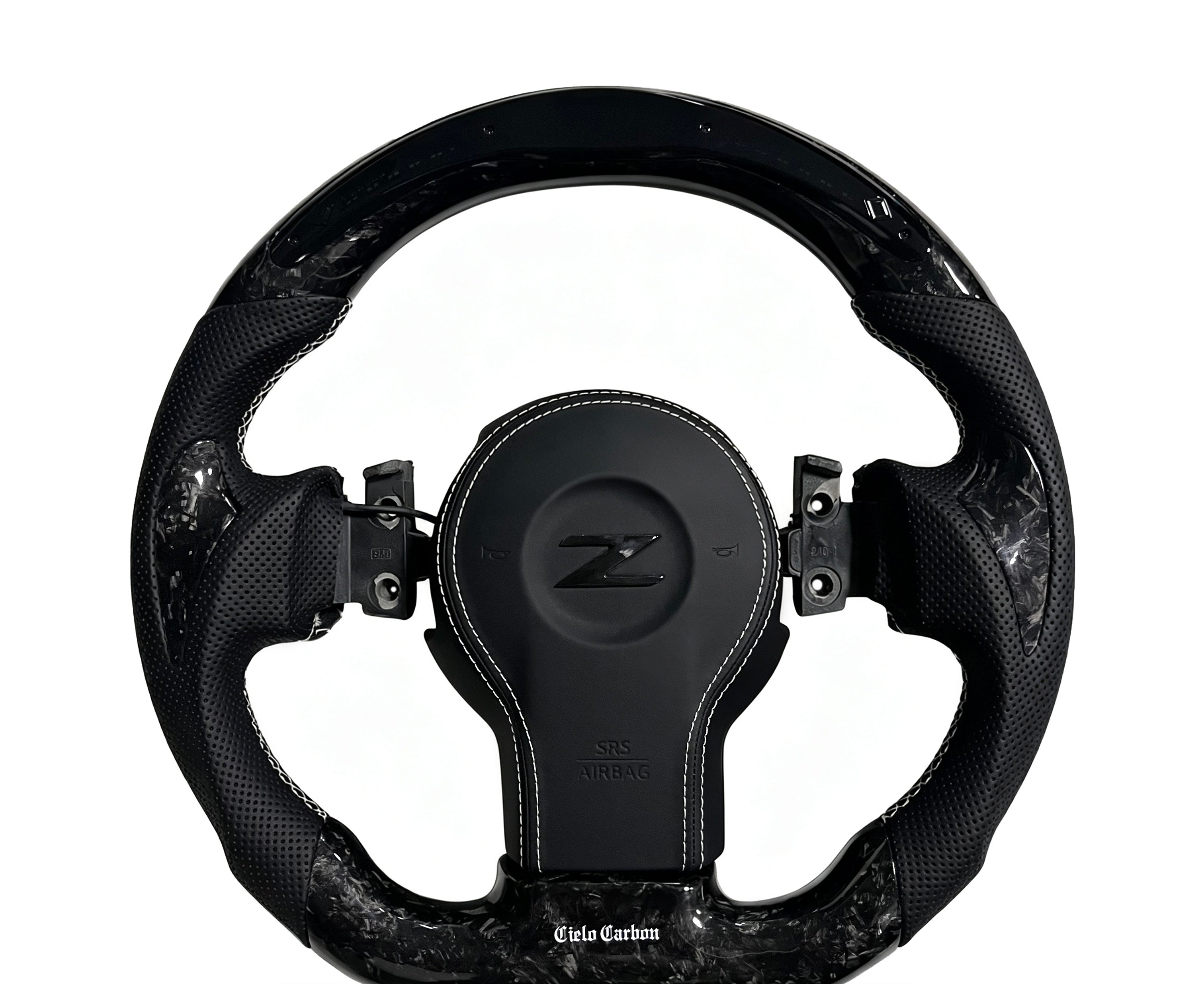Nissan Carbon Fibre Steering Wheel on a clean white background