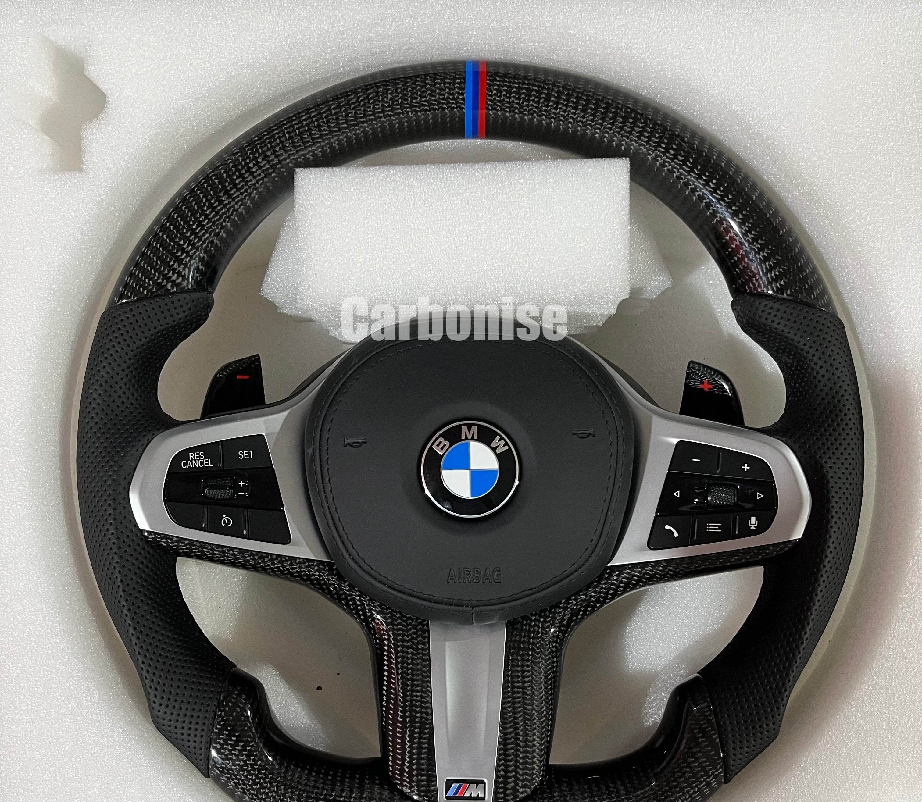 BMW Carbon Fibre Steering Wheel on a clean white background